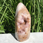 Quartz Crystals over Rose Jasper Geode