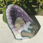 Large Calcite in a Small Amethyst Geode