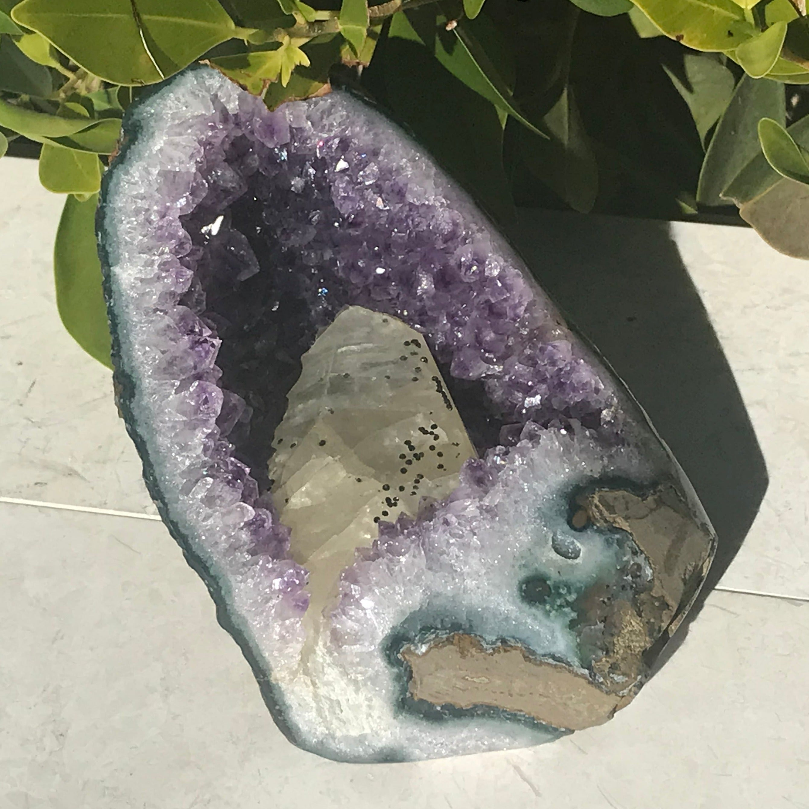 Large Calcite in a Small Amethyst Geode