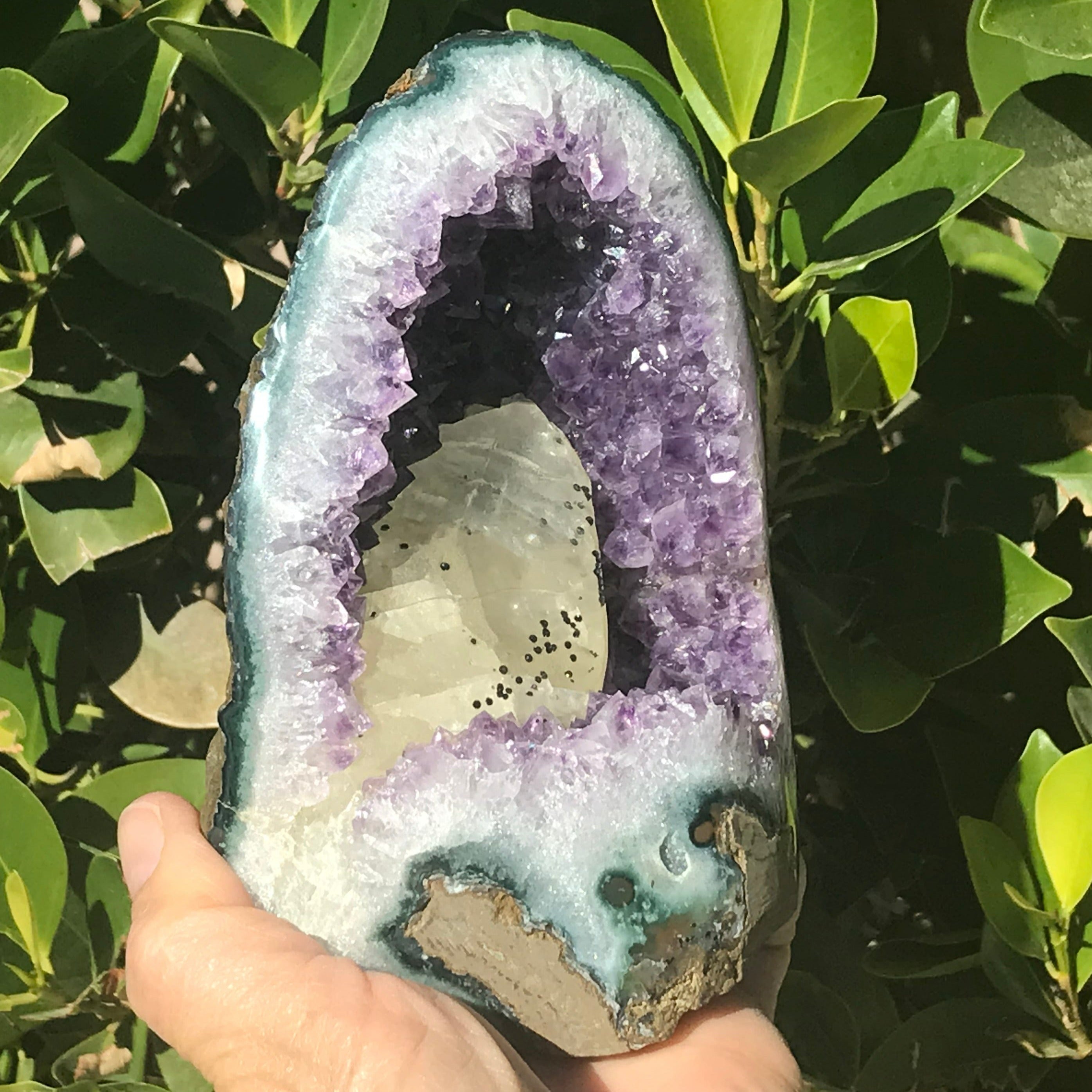 Large Calcite in a Small Amethyst Geode
