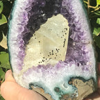Large Calcite in a Small Amethyst Geode