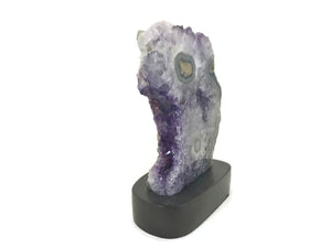 Blue Banded Agate Eyes surrounded by Amethyst Crystals.